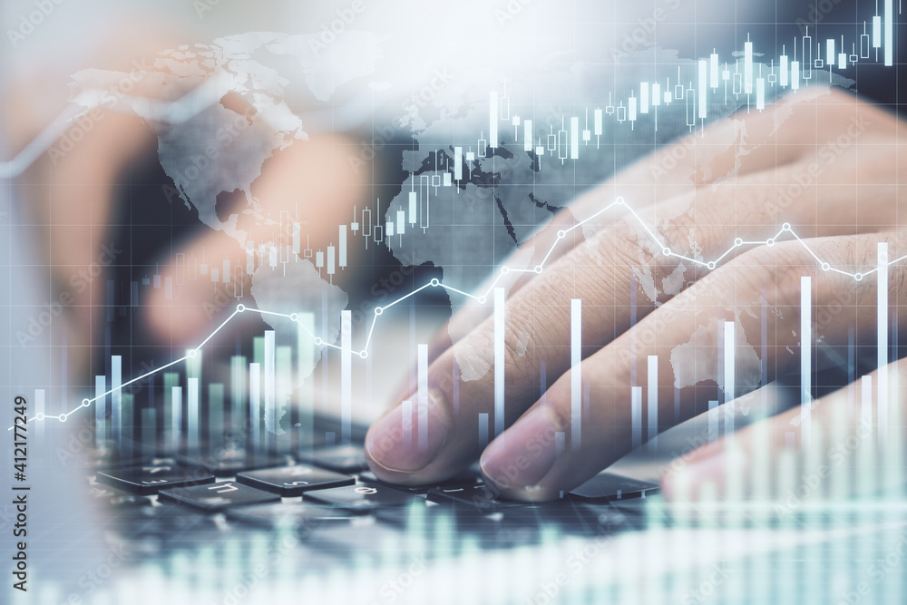 Poster Growing stock market concept with man hand typing on keyboard and digital screen with glowing financial chart and graphs. Double exposure.
