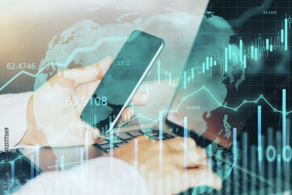 Poster Businessman trader works on laptop and smartphone and financial chart with glowing graphs on digital screen. Double exposure.