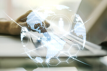 Social network media concept with world map and hands typing on computer keyboard on background. Double exposure