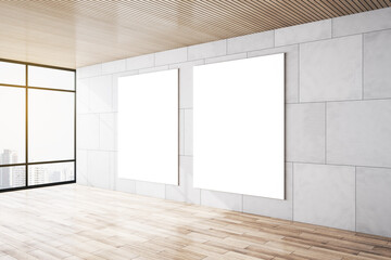Two white blank posters on light grey marble tiles wall in modern empty light room with city view, wooden floor and top. Mockup. 3D rendering