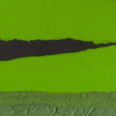 Colorful torn paper collage close-up. Texture made from various paper and cardboard parts. Damaged...