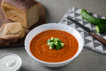 Vegetable puree tomato soup with cucumber with rye bread