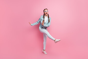 Full body photo of young excited girl happy positive smile enjoy music dance isolated over pastel color background