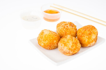 Cheese balls with chicken and mozzarella in batter and breadcrumbs