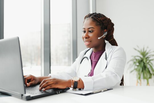 Telehealth, African American Doctor In Headset Consulting With The Patient Over The Phone Call. Health Care Call Center And Telehealth Online Concept