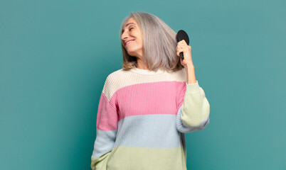 gray hair pretty woman with a hair brush