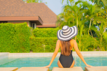 Portrait beautiful young asian woman relax smile enjoy leisure around swimming pool