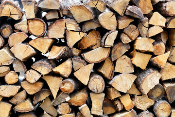 Fototapeta premium Roughly chopped wood, neatly stacked on top of each other.