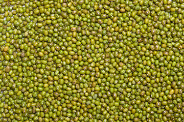 Raw green mung bean seeds texture background