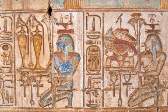 Two kneeling Nile Gods presenting the abundence, provided by the river - wall relief from Abydos
