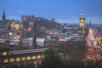 Classic night cityscape view from Calton Hill taking in Princes Street, Edinburgh Castle and the Balmoral Clock Tower at Waverley Station in Edinburgh, Scotland.