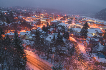 View Nelson, B.C. Canada cityscape covered in snow on a winter night from Gyro Park.