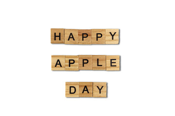 Top view of the word happy apple day laid out from square wooden tiles isolated on white background. World and international day.
