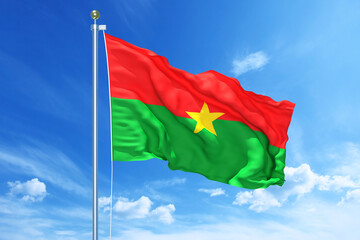 Burkina Faso flag waving on a high quality blue cloudy sky, 3d illustration