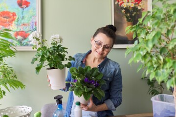 Woman with home plants in pots, hobbies and leisure