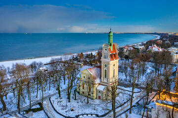 Beautiful church by snowy Baltic Sea in Sopot at dusk. Poland