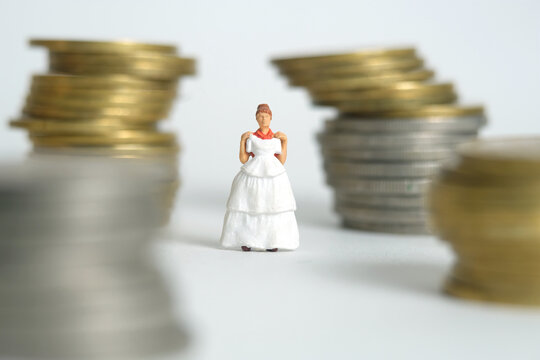 Wedding dress budget for bride, miniature people illustration concept. Woman standing between coin money stack. Image photo - Powered by Adobe