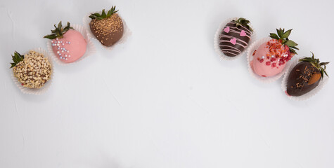 Fototapeta na wymiar Assorted strawberries in chocolate, sweet dessert, free space for your text, sprinkled with nuts, top view, isolated background.