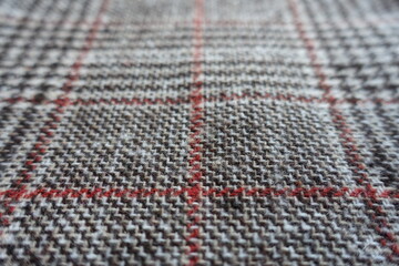 Close up of red and grey Glen check fabric