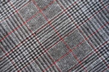 Red and grey Glen check fabric from above