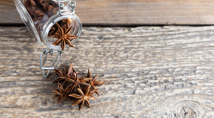 Star anise seed on a kitchen table. A spice commonly called star anise, staranise, star anise seed, Chinese star anise, badian that closely resembles anise in flavor.