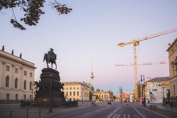 Fototapeta na wymiar Sunset or sunrise cityscape view of the Equestrian statue of Frederick the Great along Unter den Linden leading to the Berliner Dom and tv tower in Berlin, Germany.