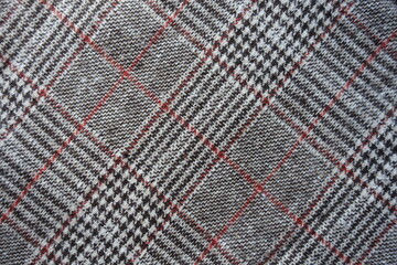 Texture of gray and red Glen check fabric from above