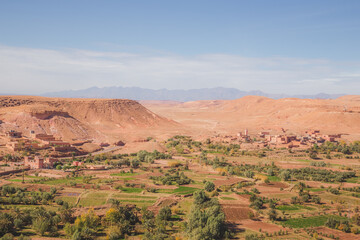 Desert landscape view of oasis old town village Ait Benhaddou, Morocco a historic fortified village, noted for its ancient clay earthen architecture.