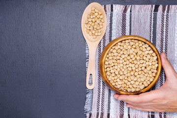 Raw Chickpeas in a bowl. Chickpeas is nutritious food. Healthy and natural vegetarian food. flat lay