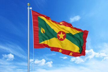 Grenada flag waving on a high quality blue cloudy sky, 3d illustration