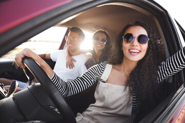 Happy friends together in car on road trip