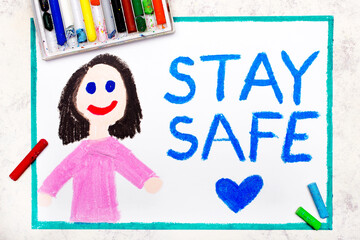 Photo of colorful drawing: Smiling girl and words Stay Safe