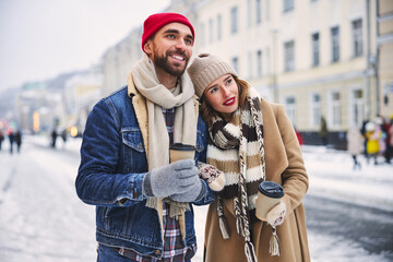 Happy stylish couple dating in winter outdoors