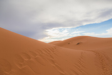 Fototapeta na wymiar The desert sand dune landscape of Erg Chebbi near the village of Merzouga in southeastern Morocco.