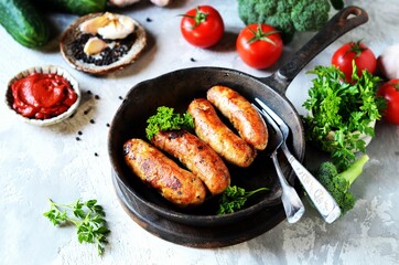 Homemade sausages from turkey (chicken) fried in a frying pan
