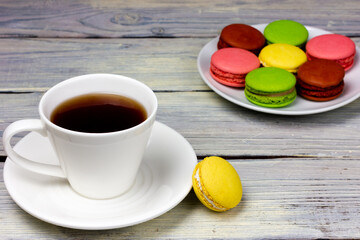 A cup of coffee and a small macaroon cookie. Provence style.