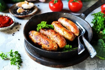 Homemade sausages from turkey (chicken) fried in a frying pan