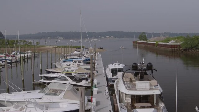 Rising Aerial View Of Boats Docked At Marina In Glen Cove Long Island