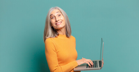 gray hair pretty woman with a laptop.