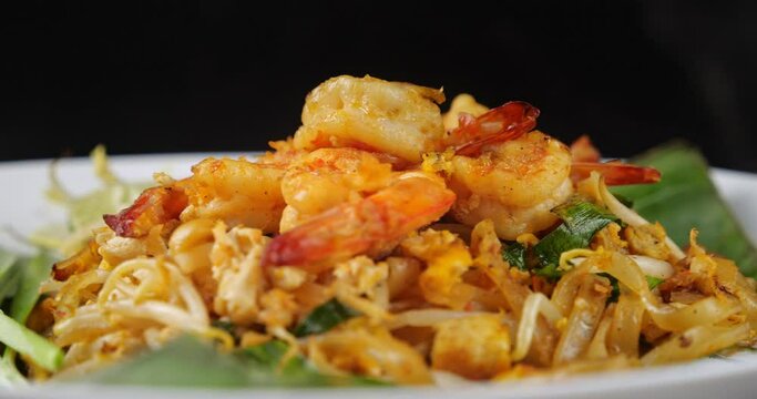 Thai traditional food, Shrimp Pad Thai, dry noodle, street food, Thai food style. Close up