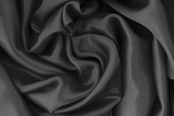 Dark grey fabric cloth texture for background and design art work, beautiful crumpled pattern of silk or linen.