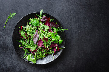 salad lettuce leaves vegetables mix greens portion on the table healthy meal snack outdoor top view copy space for text food background rustic image