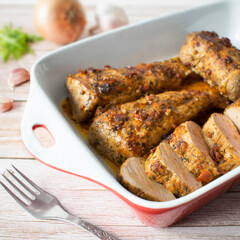 Baked tenderloin in a marinade with honey and sun-dried tomatoes