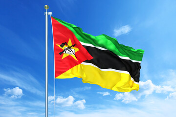 Fototapeta na wymiar Mozambique flag waving on a high quality blue cloudy sky, 3d illustration