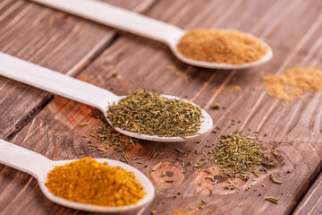 Set spices in measuring spoon. Cooking and seasoning for taste.