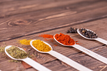 Set spices in measuring spoon. Cooking and seasoning for taste.