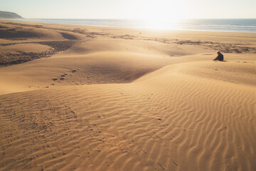 Sandy dunes at the beach outside the seaside fishing village of Tafedna in Essaouira province, Morocco.
