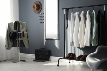 Dressing room interior with clothing rack and mirror