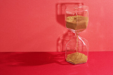 hour glass on the red background
