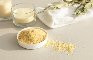 Zero waste personal care products. Natural mustard seed body scrub, dried eucalyptus branche, essential oil and candle.